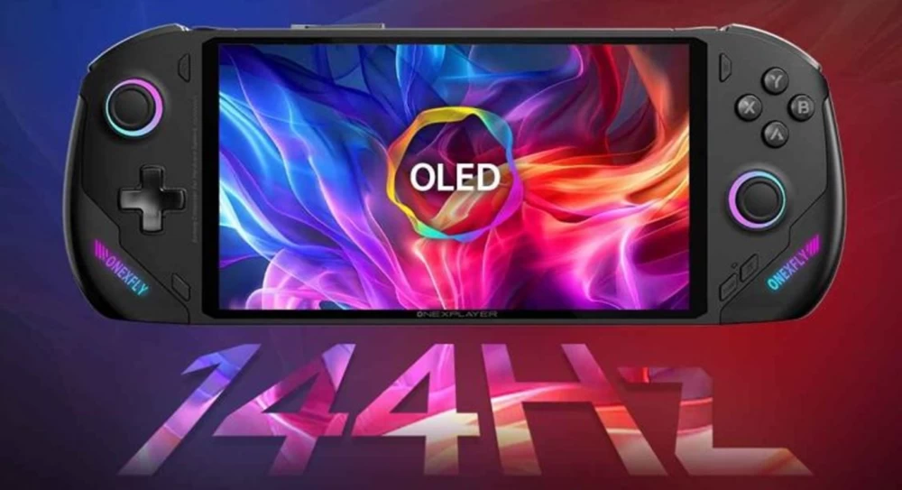 

A gamer holding the latest portable console of 2024, sitting next to the tree

