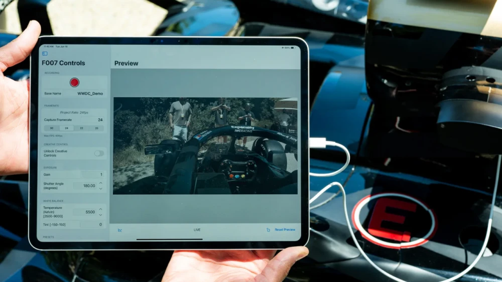 An operator mounts the new <a href='/topics/apple'>Apple</a> gadget on the body of the car for a dynamic shot from inside the race