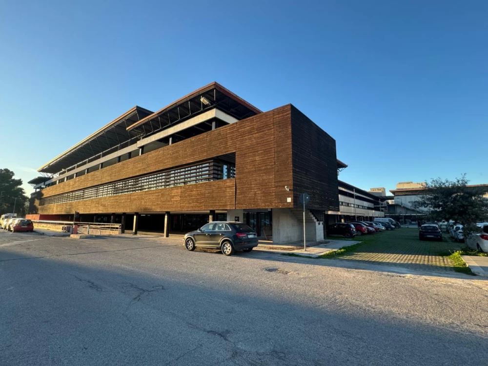 ACM RecSys 2024 logo against the backdrop of a conference hall with participants.
