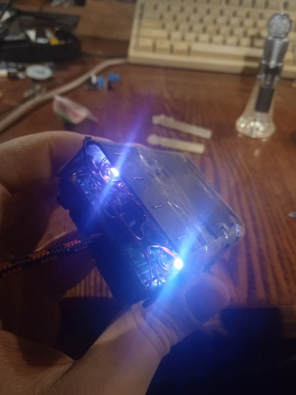 Space station in deep space with overlaid sensor graphics.
