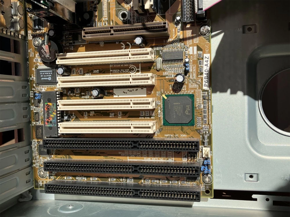 Parts of the retro computer: motherboard, processor, and other components in focus.