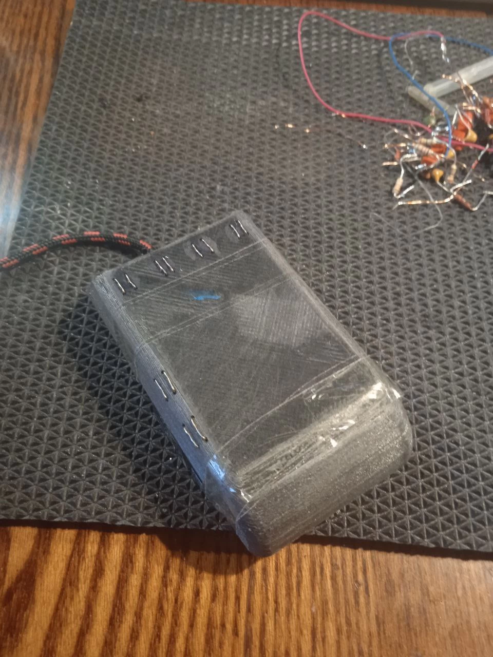 Image of a hand touching a futuristic spacecraft.
