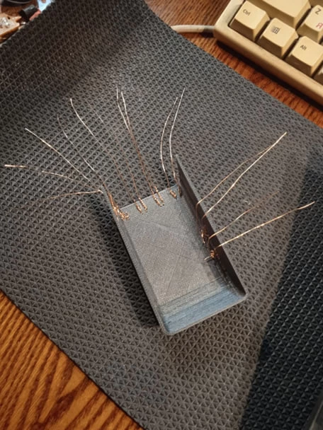 each 2 wires are one terminal of the capacitive sensor (wanted to make more contact area)