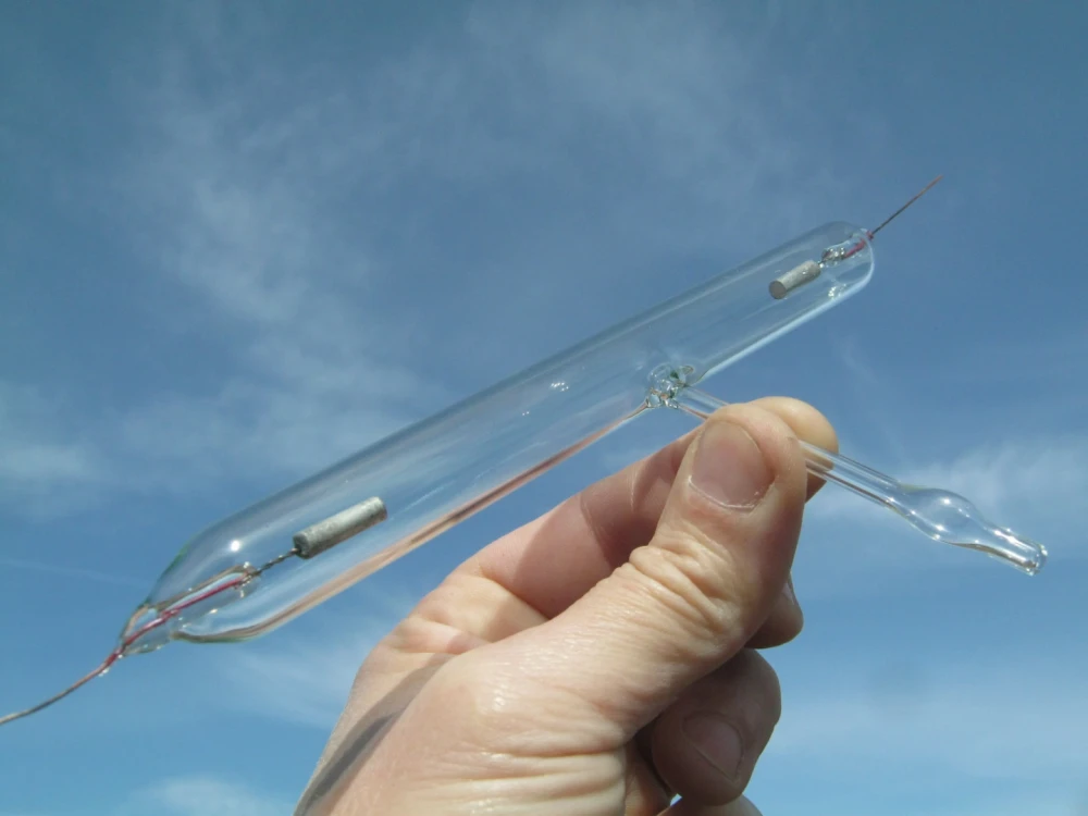 Photo 1.5. Mr. Minier uses not thin aluminum wire for discharge tube electrodes (Geissler tube) for coarse indication of vacuum levels in his low vacuum system. An interesting way to connect aluminum to another metal wire is similar to fusing platinum into copper. The photo shows the author's Geissler tube with similar electrodes [1]