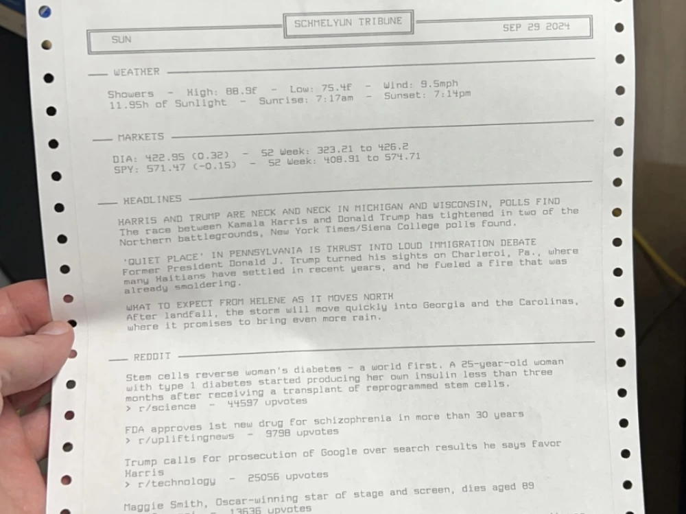 2. Image of a dot matrix printer printing fresh news, with newspapers and magazines around.