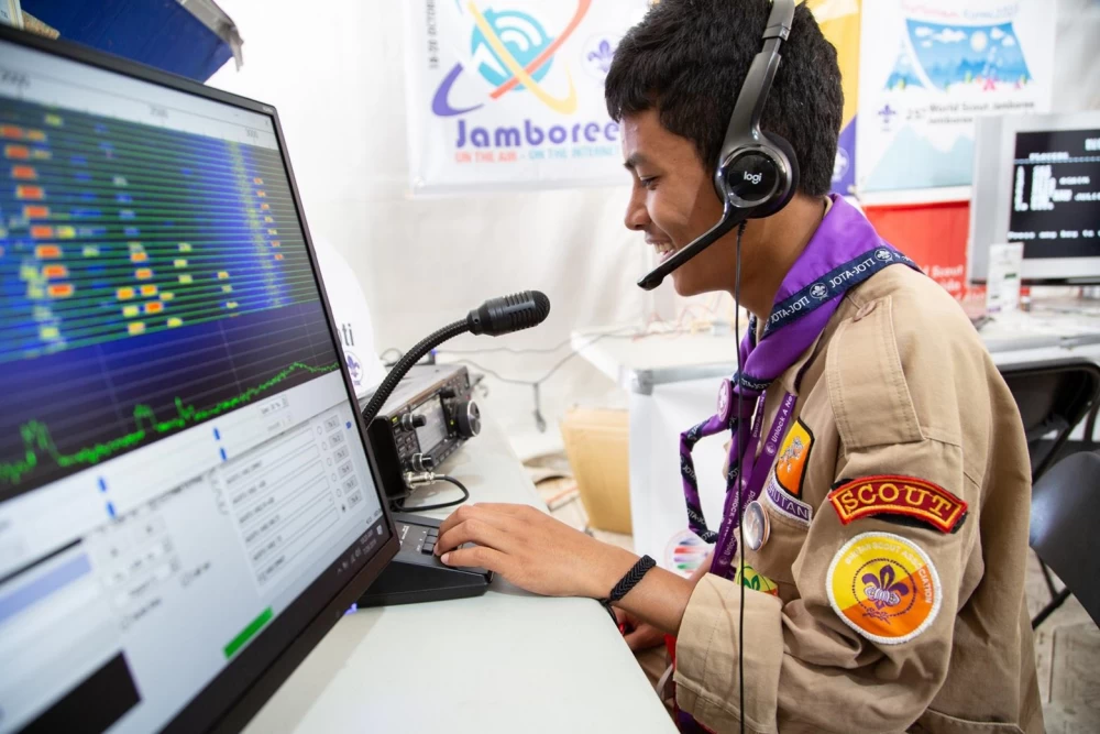A scout from India (Bhutan) goes on the air from a collective radio station as part of JOTA-JOTI