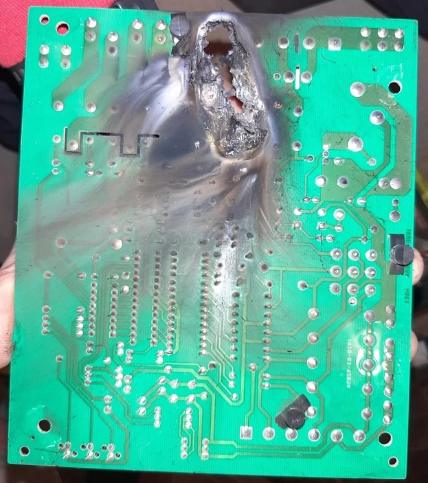 Tin monster with burning eyes attacking the village