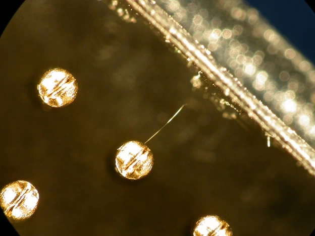 Tin monster destroys a stone castle against the backdrop of a sunset