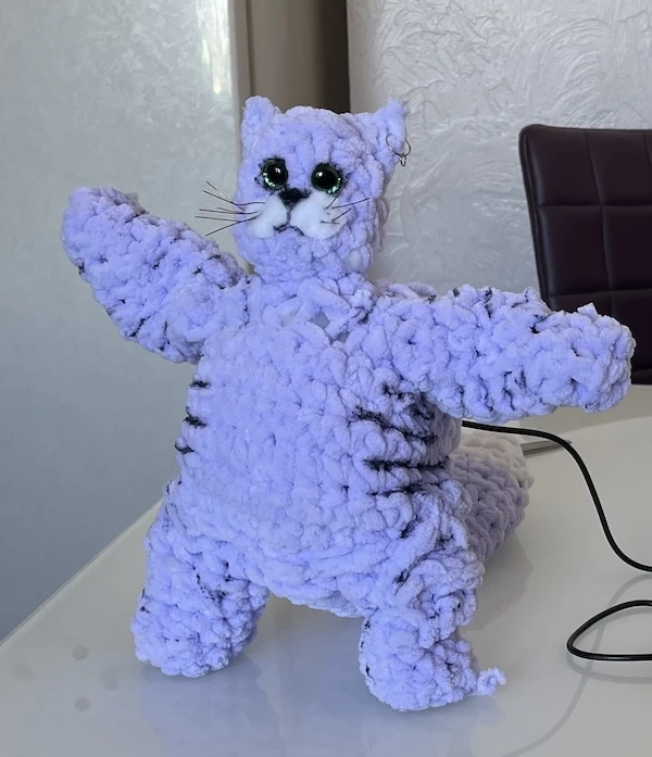 An engineer on a break at a café, discussing the latest technical achievements with colleagues.