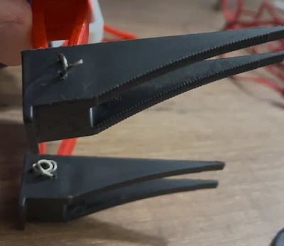 A group of engineers working on creating a new robot using a 3D printer.