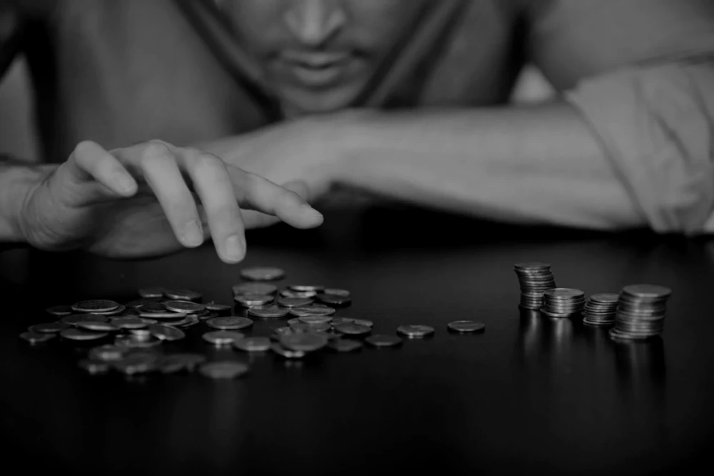 
A sinister shadow over the keyboard, symbolizing the threat of cyberattacks and password leaks.

