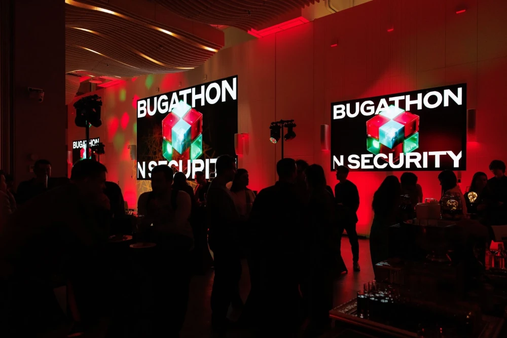 A team of young specialists analyzes code on the screen