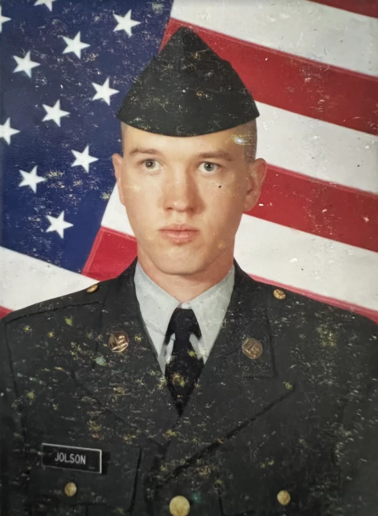 Two soldiers hug after a long-awaited reunion thanks to OSINT.
