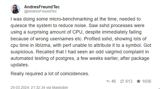 Silhouette of a man in a dark room with a laptop, the background wall covered with schematics and diagrams